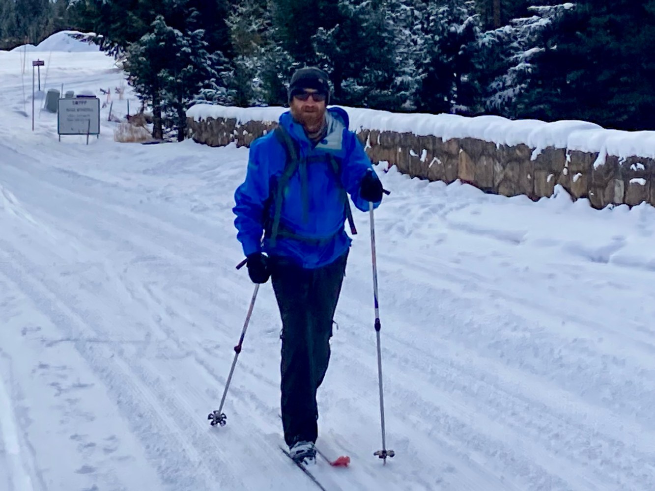 a man is cross country skiing in the snow